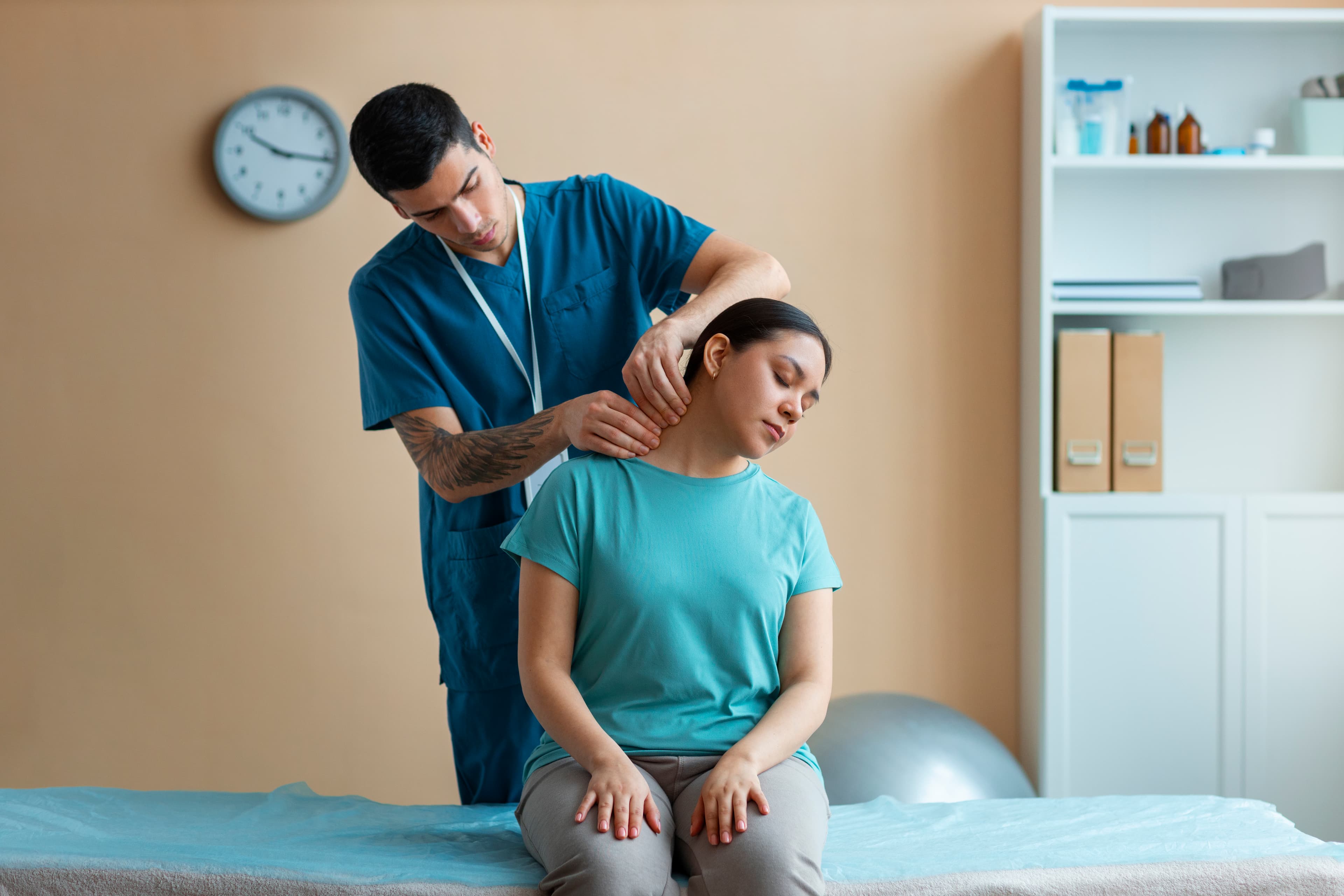 Physiotherapist examining a patient with shoulder pain